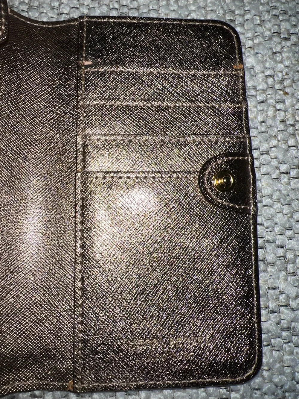 henri bendel metallic rose gold wallet with gold-tone plaque